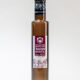 Eine braune Flasche mit Traubenkernöl und einem Etikett von Kochschneider vor weißem Hintergrund